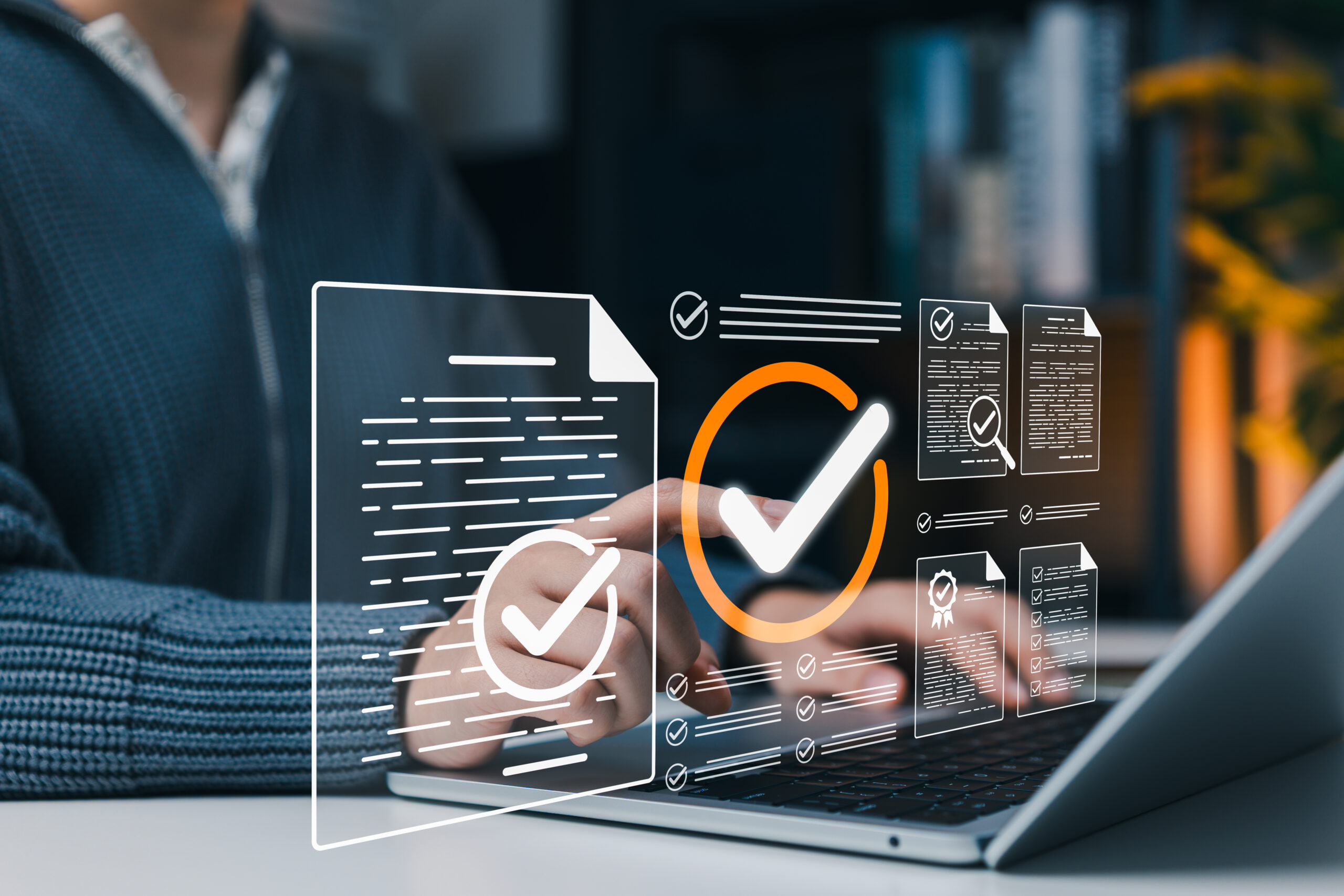 Document verification approval and compliance checklist concept. Person using laptop with verified files, check marks, certificate, review forms, quality control, audit process, business assurance
